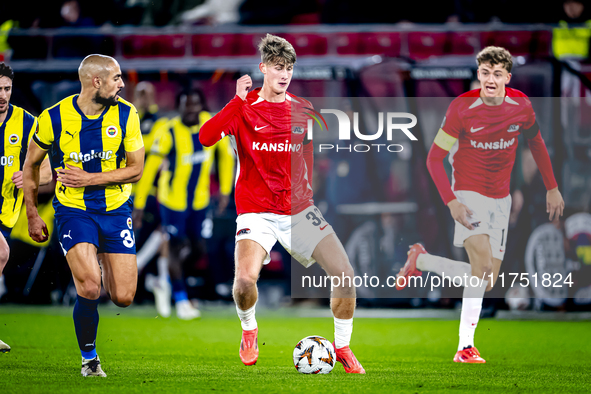 Fenerbahce midfielder Sofyan Amrabat and AZ Alkmaar midfielder Dave Kwakman play during the match between AZ and Fenerbahce at the AFAS Stad...