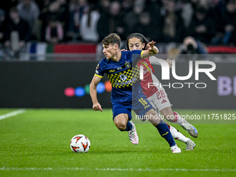 Maccabi Tel Aviv midfielder Gavriel Kanichowsky and AFC Ajax Amsterdam midfielder Kian Fitz-Jim play during the match between Ajax and Macca...