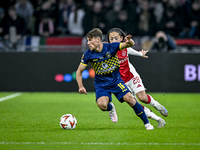 Maccabi Tel Aviv midfielder Gavriel Kanichowsky and AFC Ajax Amsterdam midfielder Kian Fitz-Jim play during the match between Ajax and Macca...