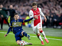 Maccabi Tel Aviv forward Dor Turgeman and AFC Ajax Amsterdam forward Mika Godts play during the match between Ajax and Maccabi Tel Aviv at t...