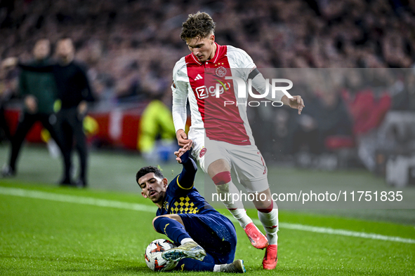 Maccabi Tel Aviv forward Dor Turgeman and AFC Ajax Amsterdam forward Mika Godts play during the match between Ajax and Maccabi Tel Aviv at t...