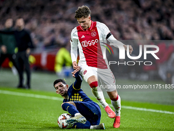 Maccabi Tel Aviv forward Dor Turgeman and AFC Ajax Amsterdam forward Mika Godts play during the match between Ajax and Maccabi Tel Aviv at t...