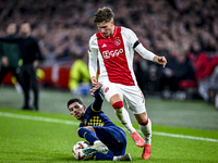 Maccabi Tel Aviv forward Dor Turgeman and AFC Ajax Amsterdam forward Mika Godts play during the match between Ajax and Maccabi Tel Aviv at t...