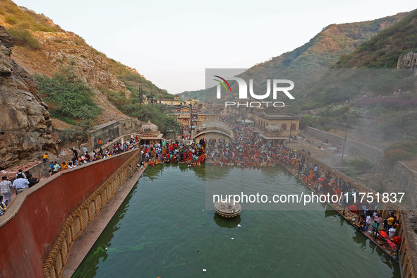 Hindu devotees perform rituals of the 'Chhath Puja' festival at the Shrine Galta Ji temple Kund in Jaipur, Rajasthan, India, on November 7,...