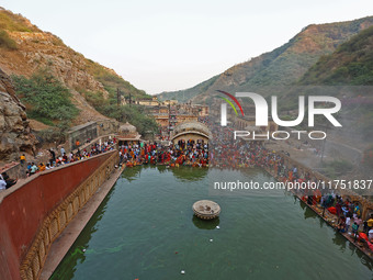 Hindu devotees perform rituals of the 'Chhath Puja' festival at the Shrine Galta Ji temple Kund in Jaipur, Rajasthan, India, on November 7,...