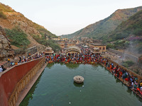 Hindu devotees perform rituals of the 'Chhath Puja' festival at the Shrine Galta Ji temple Kund in Jaipur, Rajasthan, India, on November 7,...