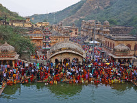 Hindu devotees perform rituals of the 'Chhath Puja' festival at the Shrine Galta Ji temple Kund in Jaipur, Rajasthan, India, on November 7,...