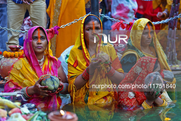 Hindu devotees perform rituals of the 'Chhath Puja' festival at the Shrine Galta Ji temple Kund in Jaipur, Rajasthan, India, on November 7,...