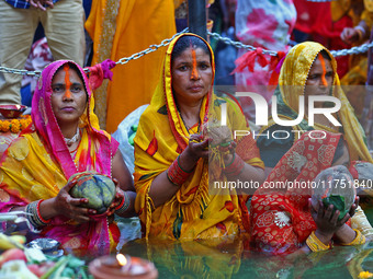 Hindu devotees perform rituals of the 'Chhath Puja' festival at the Shrine Galta Ji temple Kund in Jaipur, Rajasthan, India, on November 7,...