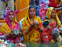 Hindu devotees perform rituals of the 'Chhath Puja' festival at the Shrine Galta Ji temple Kund in Jaipur, Rajasthan, India, on November 7,...