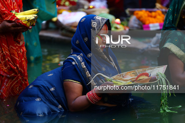 Hindu devotees perform rituals of the 'Chhath Puja' festival at the Shrine Galta Ji temple Kund in Jaipur, Rajasthan, India, on November 7,...