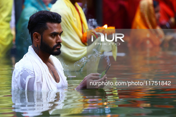 Hindu devotees perform rituals of the 'Chhath Puja' festival at the Shrine Galta Ji temple Kund in Jaipur, Rajasthan, India, on November 7,...