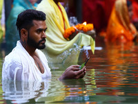 Hindu devotees perform rituals of the 'Chhath Puja' festival at the Shrine Galta Ji temple Kund in Jaipur, Rajasthan, India, on November 7,...