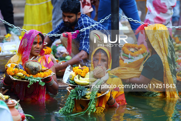 Hindu devotees perform rituals of the 'Chhath Puja' festival at the Shrine Galta Ji temple Kund in Jaipur, Rajasthan, India, on November 7,...