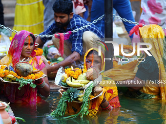 Hindu devotees perform rituals of the 'Chhath Puja' festival at the Shrine Galta Ji temple Kund in Jaipur, Rajasthan, India, on November 7,...