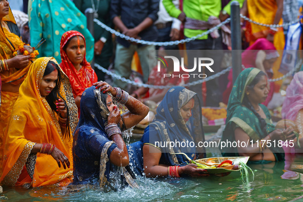 Hindu devotees perform rituals of the 'Chhath Puja' festival at the Shrine Galta Ji temple Kund in Jaipur, Rajasthan, India, on November 7,...