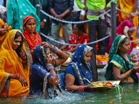 Hindu devotees perform rituals of the 'Chhath Puja' festival at the Shrine Galta Ji temple Kund in Jaipur, Rajasthan, India, on November 7,...