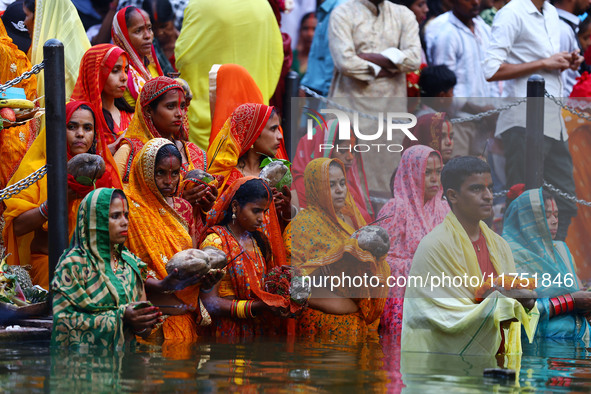 Hindu devotees perform rituals of the 'Chhath Puja' festival at the Shrine Galta Ji temple Kund in Jaipur, Rajasthan, India, on November 7,...