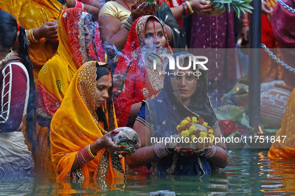 Hindu devotees perform rituals of the 'Chhath Puja' festival at the Shrine Galta Ji temple Kund in Jaipur, Rajasthan, India, on November 7,...