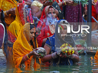 Hindu devotees perform rituals of the 'Chhath Puja' festival at the Shrine Galta Ji temple Kund in Jaipur, Rajasthan, India, on November 7,...