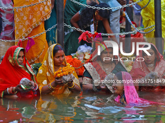 Hindu devotees perform rituals of the 'Chhath Puja' festival at the Shrine Galta Ji temple Kund in Jaipur, Rajasthan, India, on November 7,...