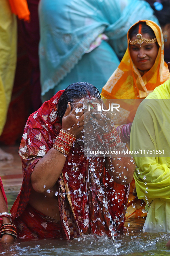 Hindu devotees perform rituals of the 'Chhath Puja' festival at the Shrine Galta Ji temple Kund in Jaipur, Rajasthan, India, on November 7,...