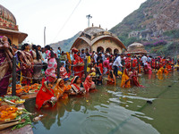 Hindu devotees perform rituals of the 'Chhath Puja' festival at the Shrine Galta Ji temple Kund in Jaipur, Rajasthan, India, on November 7,...