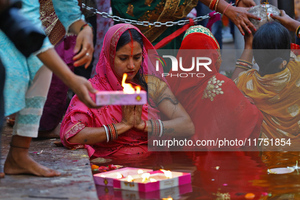 Hindu devotees perform rituals of the 'Chhath Puja' festival at the Shrine Galta Ji temple Kund in Jaipur, Rajasthan, India, on November 7,...