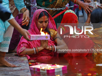 Hindu devotees perform rituals of the 'Chhath Puja' festival at the Shrine Galta Ji temple Kund in Jaipur, Rajasthan, India, on November 7,...