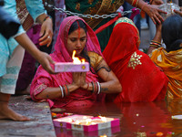 Hindu devotees perform rituals of the 'Chhath Puja' festival at the Shrine Galta Ji temple Kund in Jaipur, Rajasthan, India, on November 7,...