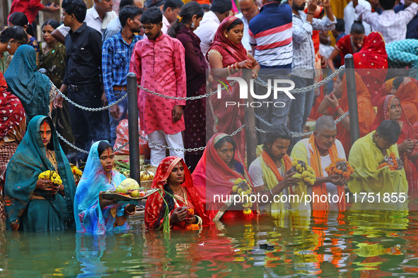 Hindu devotees perform rituals of the 'Chhath Puja' festival at the Shrine Galta Ji temple Kund in Jaipur, Rajasthan, India, on November 7,...