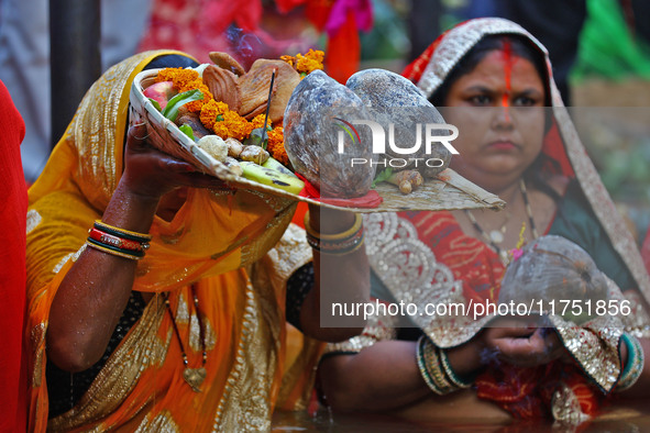 Hindu devotees perform rituals of the 'Chhath Puja' festival at the Shrine Galta Ji temple Kund in Jaipur, Rajasthan, India, on November 7,...