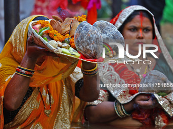 Hindu devotees perform rituals of the 'Chhath Puja' festival at the Shrine Galta Ji temple Kund in Jaipur, Rajasthan, India, on November 7,...