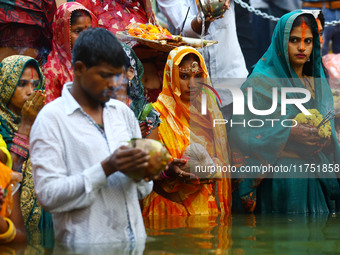 Hindu devotees perform rituals of the 'Chhath Puja' festival at the Shrine Galta Ji temple Kund in Jaipur, Rajasthan, India, on November 7,...