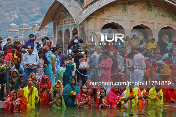 Hindu devotees perform rituals of the 'Chhath Puja' festival at the Shrine Galta Ji temple Kund in Jaipur, Rajasthan, India, on November 7,...