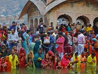 Hindu devotees perform rituals of the 'Chhath Puja' festival at the Shrine Galta Ji temple Kund in Jaipur, Rajasthan, India, on November 7,...