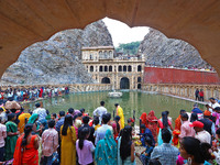 Hindu devotees perform rituals of the 'Chhath Puja' festival at the Shrine Galta Ji temple Kund in Jaipur, Rajasthan, India, on November 7,...