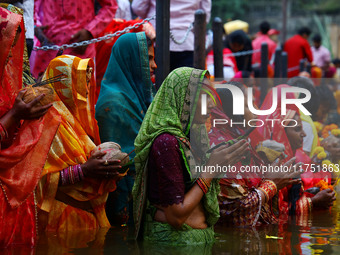 Hindu devotees perform rituals of the 'Chhath Puja' festival at the Shrine Galta Ji temple Kund in Jaipur, Rajasthan, India, on November 7,...