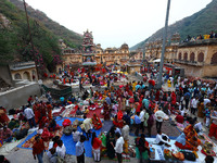 Hindu devotees arrive to perform rituals of the 'Chhath Puja' festival at the Shrine Galta Ji temple Kund in Jaipur, Rajasthan, India, on No...