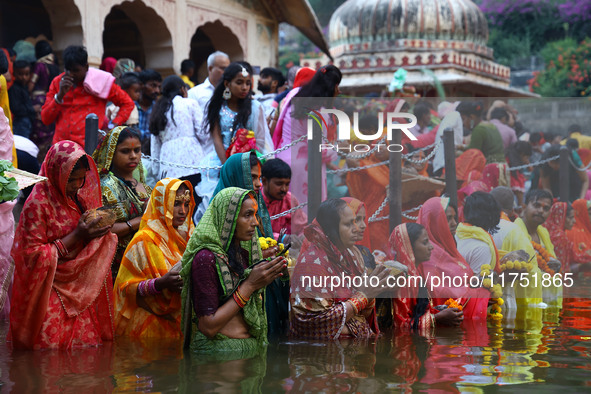 Hindu devotees perform rituals of the 'Chhath Puja' festival at the Shrine Galta Ji temple Kund in Jaipur, Rajasthan, India, on November 7,...