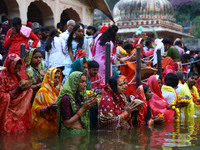 Hindu devotees perform rituals of the 'Chhath Puja' festival at the Shrine Galta Ji temple Kund in Jaipur, Rajasthan, India, on November 7,...