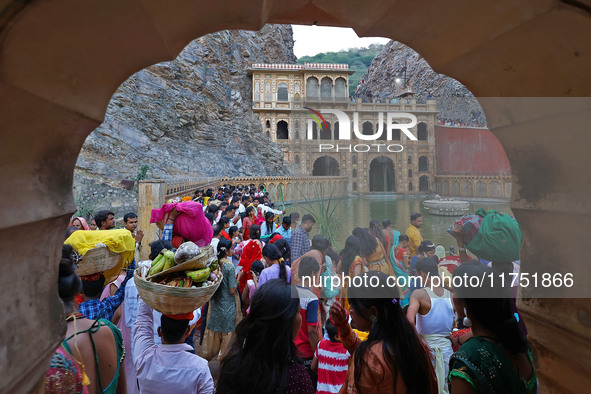 Hindu devotees perform rituals of the 'Chhath Puja' festival at the Shrine Galta Ji temple Kund in Jaipur, Rajasthan, India, on November 7,...