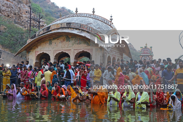 Hindu devotees perform rituals of the 'Chhath Puja' festival at the Shrine Galta Ji temple Kund in Jaipur, Rajasthan, India, on November 7,...