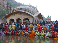 Hindu devotees perform rituals of the 'Chhath Puja' festival at the Shrine Galta Ji temple Kund in Jaipur, Rajasthan, India, on November 7,...