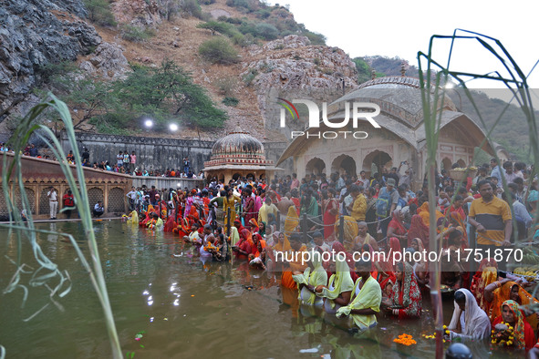 Hindu devotees perform rituals of the 'Chhath Puja' festival at the Shrine Galta Ji temple Kund in Jaipur, Rajasthan, India, on November 7,...