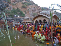 Hindu devotees perform rituals of the 'Chhath Puja' festival at the Shrine Galta Ji temple Kund in Jaipur, Rajasthan, India, on November 7,...