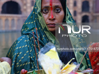 A Hindu devotee performs rituals of the 'Chhath Puja' festival at the Shrine Galta Ji temple Kund in Jaipur, Rajasthan, India, on November 7...