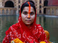 A Hindu devotee performs rituals of the 'Chhath Puja' festival at the Shrine Galta Ji temple Kund in Jaipur, Rajasthan, India, on November 7...