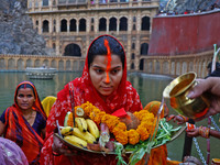 A Hindu devotee performs rituals of the 'Chhath Puja' festival at the Shrine Galta Ji temple Kund in Jaipur, Rajasthan, India, on November 7...