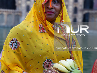 A Hindu devotee performs rituals of the 'Chhath Puja' festival at the Shrine Galta Ji temple Kund in Jaipur, Rajasthan, India, on November 7...